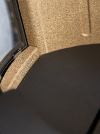 Side view of Aduro 17 wood burning stove showcasing large glass panels and elegant control handle.