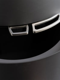 Side view of Aduro 17 wood burning stove showcasing large glass panels and elegant control handle.