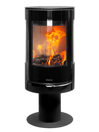 Side view of Aduro 22.3 Lux wood burning stove with glossy glass door and elegant pedestal design.