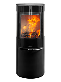 Side view of Aduro 22.5 Lux wood burning stove with black glass door and slender design, showcasing elevated combustion chamber.