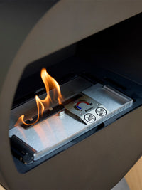 Side view of Aduro B2 bioethanol fireplace showcasing its sleek design and open front for warmth and ambiance.
