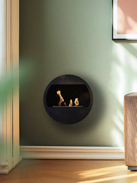 Side view of Aduro B2 bioethanol fireplace showcasing its sleek design and open front for warmth and ambiance.