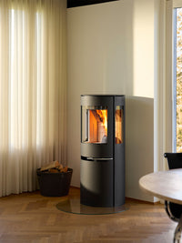 Side view of Aduro H1 Hybrid Stove showcasing large glass area and sleek design in black finish.
