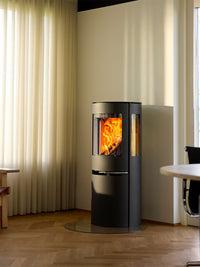 Side view of Aduro H1 Hybrid Stove showcasing the large glass area and sleek design in black finish.