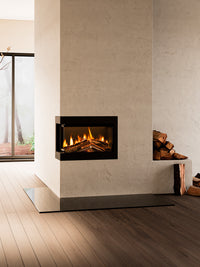Black electric fire with hand-scorched oak logs and dark glass backdrop, showcasing a three-sided view installation.
