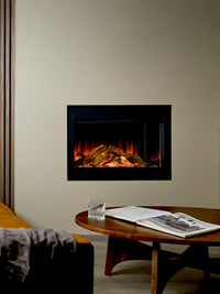 Side view of the British Fires Ashlett electric fire with dark glass backdrop and hand-scorched oak logs.