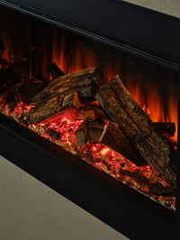 Side view of the British Fires Ashlett electric fire with dark glass backdrop and hand-scorched oak logs.