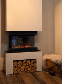 Side view of British Fires Ashlett electric fire with hand-scorched oak logs and dark glass backdrop.