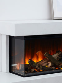 Side view of the British Fires Brockenhurst electric fire suite, showcasing its sleek design and three-sided glass.