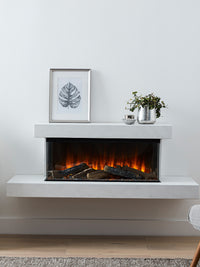 Side view of the British Fires Brockenhurst electric fire suite, showcasing its sleek design and three-sided glass.