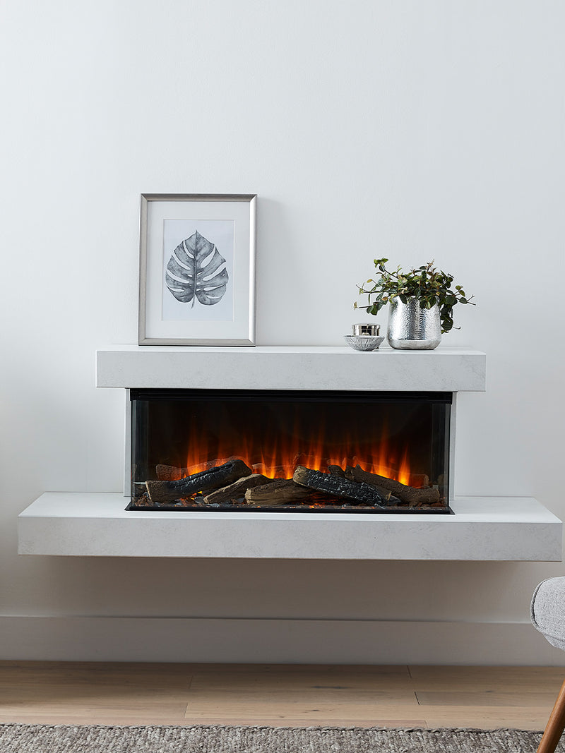 Side view of the British Fires Brockenhurst electric fire suite, showcasing its sleek design and three-sided glass.
