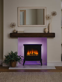 Side view of the British Fires Hinton Electric Stove showcasing its cast iron body and hand-scorched oak logs.