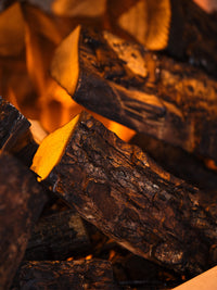 Side view of the British Fires Holbury electric fire suite, showcasing its sleek inset design and realistic flames.