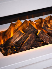 Side view of the British Fires Holbury Electric Fire Suite, showcasing its sleek inset design and realistic flames.