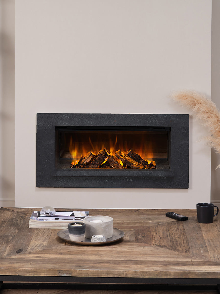 Sleek inset British Fires Holbury electric fire suite with a clean rectangle of flames, blending seamlessly into the wall.