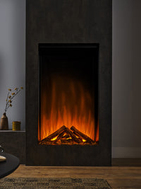 Side view of British Fires Knightwood Electric Fire with hand-scorched oak logs and mirrored glass for depth.