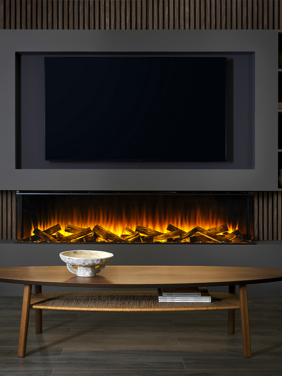 Large black electric fire with a sleek design, flush glass front, set against a modern living room backdrop.