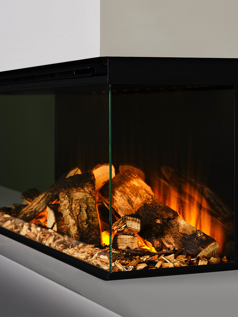 Compact British Fires New Forest 870 electric fire with sleek glass front, showcasing realistic flame visuals in a modern setting.