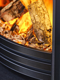 Side view of the British Fires Sway 16" electric fire in Black Chrome frame, showcasing its classic curved fret design.