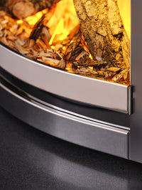 Side view of the British Fires Sway 16" electric fire in a sleek black frame, showcasing its modern design and flames.