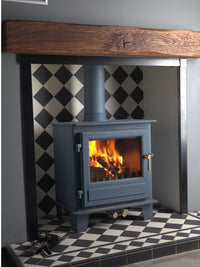 Side view of the Clock Blithfield 5 Wood Burner in Metallic Black, showcasing its sleek design and craftsmanship.
