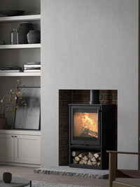 Side view of the Contura 210 wood burning stove with a classic cast iron door and sleek design, showcasing its compact size.