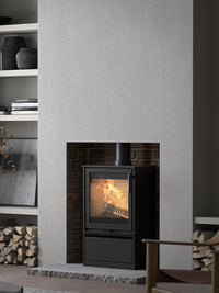 Side view of the Contura 210 wood burning stove with a classic cast iron door and sleek design, showcasing its compact size.