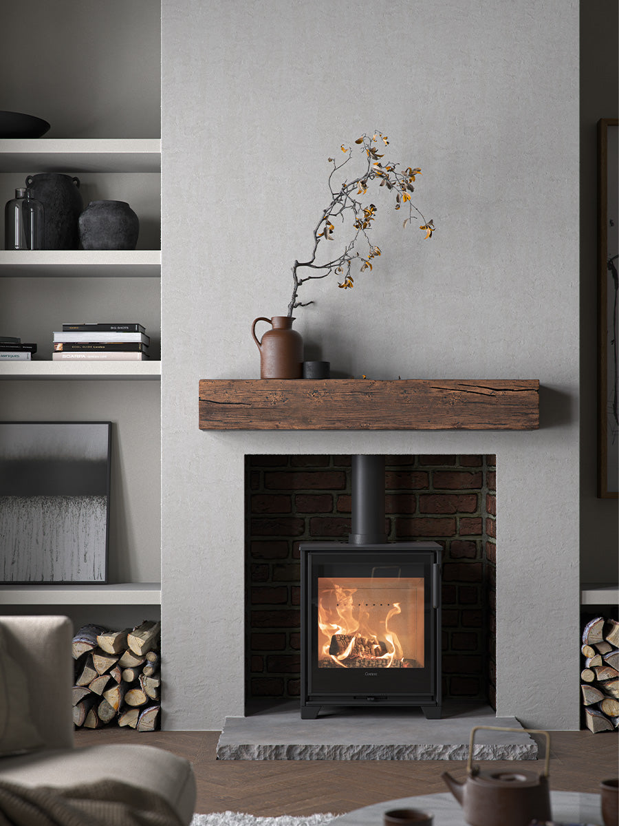 Contura 210G wood burning stove with glass door, sleek design, compact size, showcasing flames and modern aesthetics.