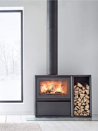 Side view of the Contura 310 wood burning stove with a sleek black finish and cast iron door, showcasing its design.