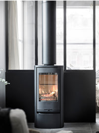Contura 810 wood burning stove in black cast iron with classic door, showcasing its elegant design and height.
