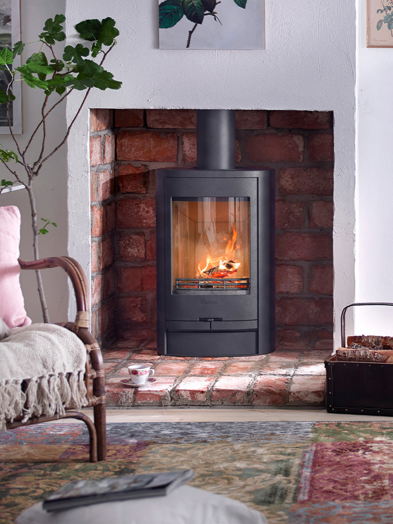 Contura 810L wood burning stove in sleek black, low-profile design with glass door, showcasing compact size and modern style.