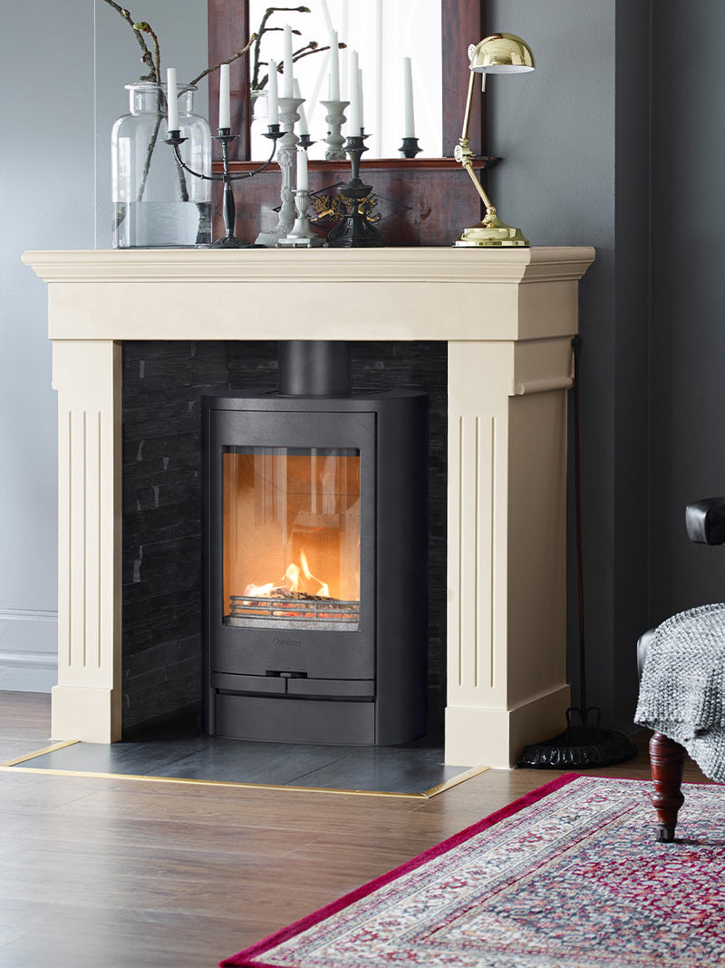 Side view of the Contura 810L wood burning stove, showcasing its sleek design and compact size in a modern room setting.