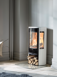 Side view of the Contura 856G wood burning stove showcasing its glass door and sleek design.