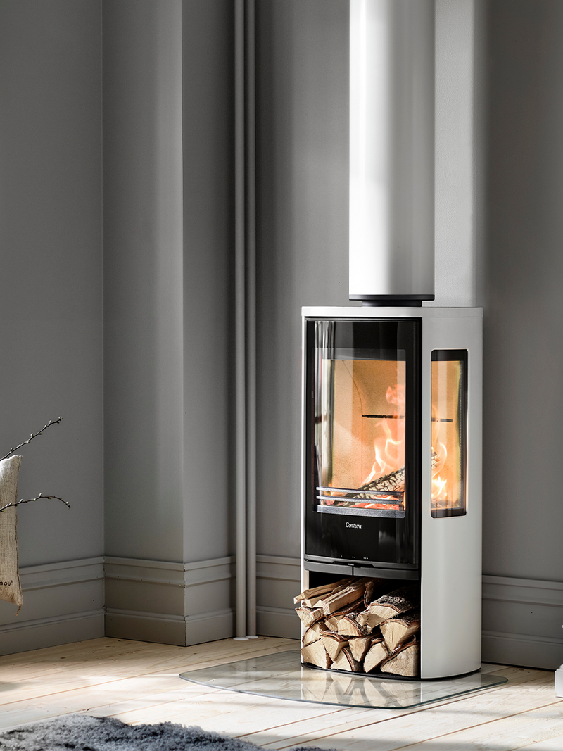 Contura 856G wood burning stove with glass door and sides, showcasing flames and modern design in sleek black finish.