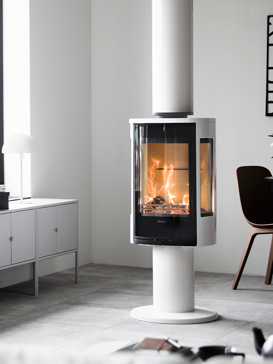 Contura 886G wood burning stove with glass door, showcasing sleek design and side panes for a floating fire effect.