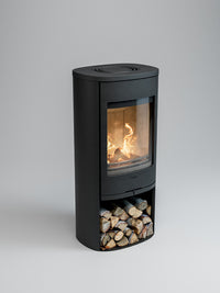 Side view of the Contura 910 wood burning stove with a cast iron door and soapstone top, showcasing its compact design.