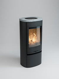 Side view of the Contura 910 wood burning stove with a cast iron door and soapstone top, showcasing its compact design.