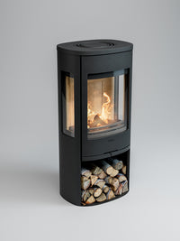 Side view of the Contura 956 wood burning stove with cast iron door and large glass panels showcasing the fire.