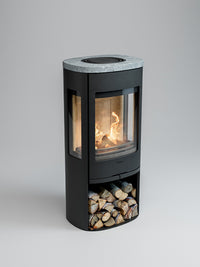Side view of Contura 956 wood burning stove with cast iron door and large glass panels showcasing the fire.