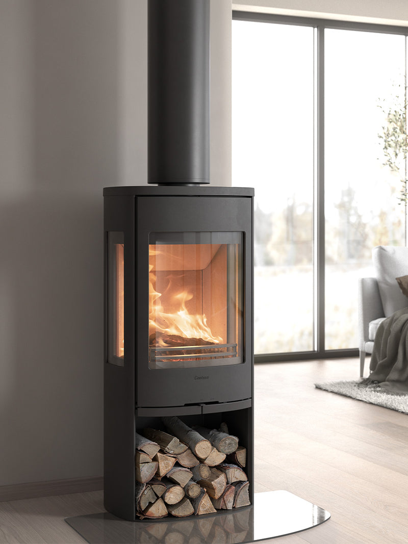 Contura 956 wood burning stove with cast iron door and large glass panels, showcasing the fire from the front and sides.