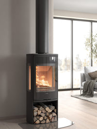 Side view of the Contura 956G wood burning stove showcasing the glass door and sleek design with side glass panels.
