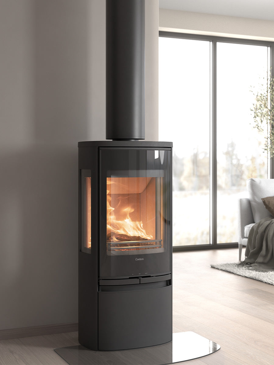 Contura 956G wood burning stove with sleek glass door and side panels, showcasing flames and painted aluminium top.