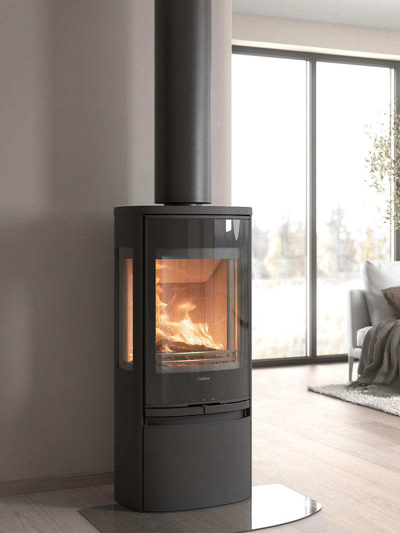 Contura 956G wood burning stove with sleek glass door and side panels, showcasing flames and painted aluminium top.