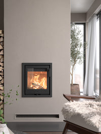 Contura i1 wood burning fireplace insert in sleek black cast iron with clean lines, shown from a front angle.