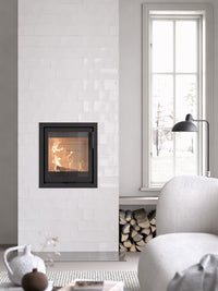 Contura i2 wood burning fireplace insert with cast iron door, showcasing compact design and glass front for efficient heating.
