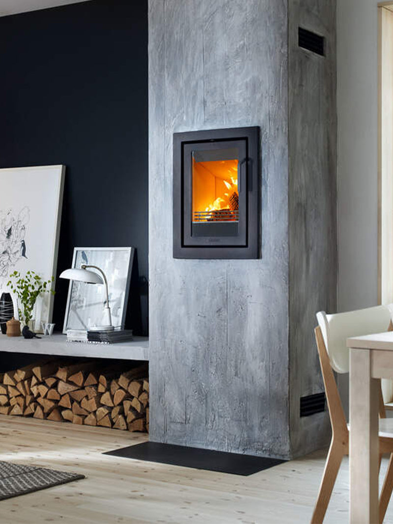 Contura i4 modern wood burning fireplace insert in black with glass door, showcasing sleek design and compact size.