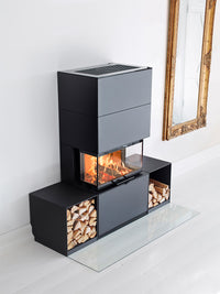 Side view of Contura i51 wood burning fireplace showcasing three glass sides and spacious firebox design.
