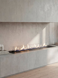 Side view of the Decoflame Denver F6 bioethanol burner showcasing its sleek design and vibrant flames in a modern setting.