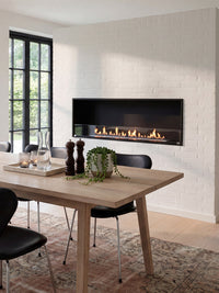 Side view of the Decoflame Montreal 1200mm bioethanol fireplace showcasing the sleek glass panel and flames.