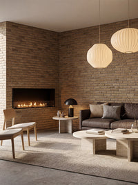 Side view of the Decoflame Montreal 1200mm bioethanol fireplace showcasing the sleek glass panel and flames.